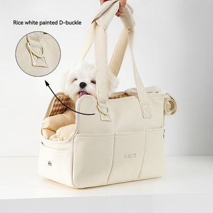 Image of small pet carrier with dog inside